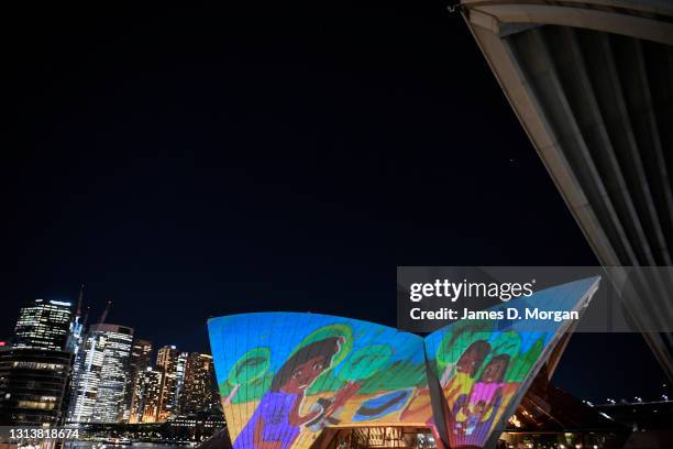 Projections of First Nations art illuminate the Opera House's eastern Bennelong sails at the Sydney Opera House on April 22, 2021 in Sydney,...