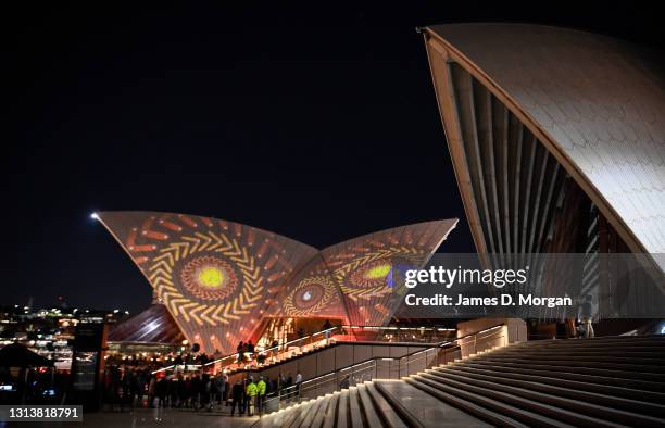 Projections of First Nations art illuminate the Opera House's eastern Bennelong sails at the Sydney Opera House on April 22, 2021 in Sydney,...