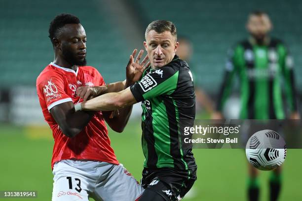 Besart Berisha of Western United and Charles Lokoli Ngoy of the Phoenix contest the ball during the A-League match between Western United FC and the...