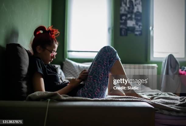 teenage girl using smart phone at home - teenager bedroom stock pictures, royalty-free photos & images