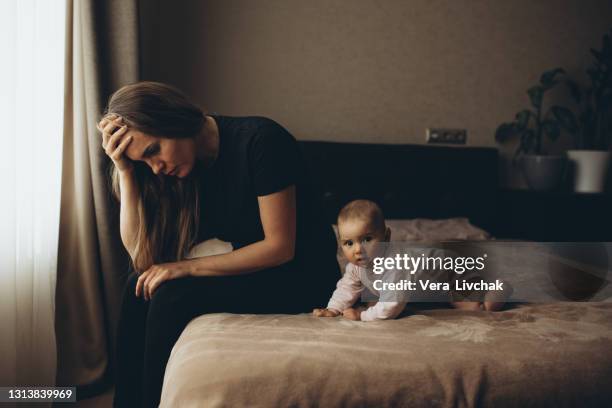 parenting and family difficulties - depressed mother stockfoto's en -beelden