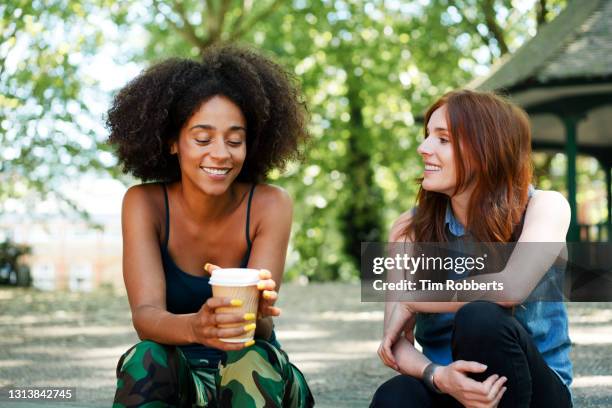 two friends hanging out together - women friends stock pictures, royalty-free photos & images