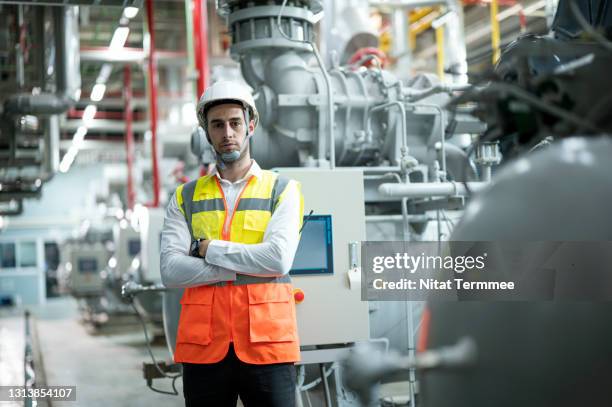 smart industrial engineer standing with arm crossed in front of water supply system in boiler room. industrial boiler water and gas supply system for production line process. - temperature sensor stock pictures, royalty-free photos & images