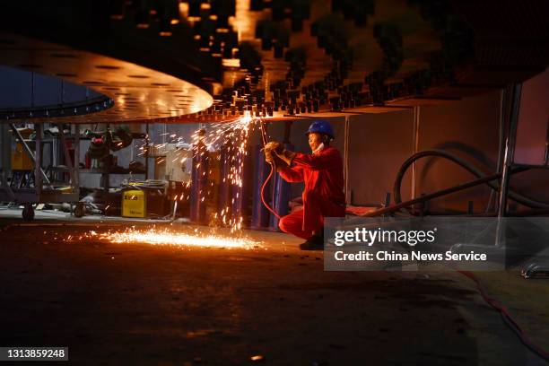 Workers install eight 1,000MW Francis type hydropower generating units in an underground powerhouse on the right banks of the Baihetan hydropower...