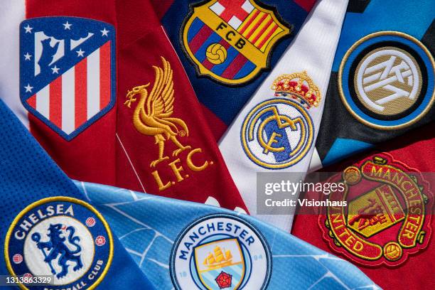 The club badges on the home shirts of some of the teams involved in the European Super League; Liverpool, Barcelona, Real Madrid, Inter Milan,...