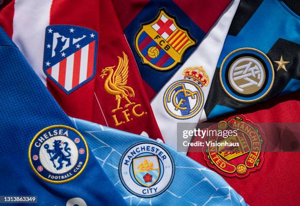 The club badges on the home shirts of some of the teams involved in the European Super League; Liverpool, Barcelona, Real Madrid, Inter Milan,...