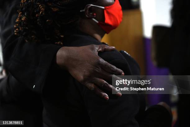 People embrace during a funeral held for Daunte Wright at Shiloh Temple International Ministries on April 22, 2021 in Minneapolis, Minnesota. Daunte...