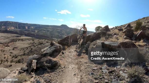 first person perspective of mountain biking desert pathway, over rocks - fruita colorado stock pictures, royalty-free photos & images