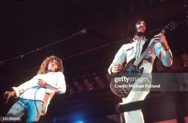 Rock band The Who perform on stage at The Oval cricket ground, London, 18th September 1971. L-R Roger Daltrey, Pete Townshend. Townshend is playing a...