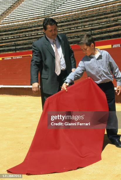 Spanish bullfighter Vicente Ruiz 'El Soro' teaches his son Vicente to bullfight in the bullring of Valencia, Spain, 2001.