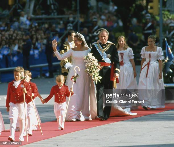 Princess Cristina and her father King Juan Carlos go to the cathedral of Barcelona to celebrate her wedding with Ignacio Urdangarin, Spain, 1997.