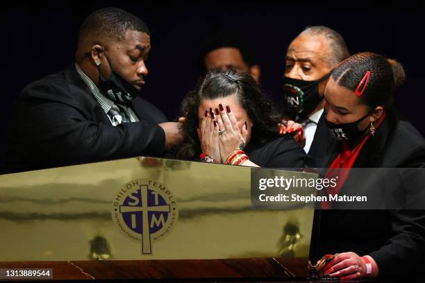 Father Arbuey Wright and mother Katie Wright give remarks alongside sister Diamond Wright and Rev Al Sharpton during a funeral held for Daunte Wright...