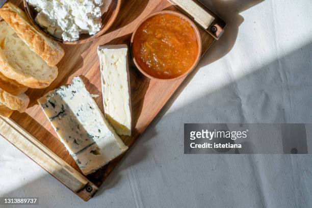 breakfast table. cheese plate with sourdough bread and orange marmalade - marmalade stock pictures, royalty-free photos & images