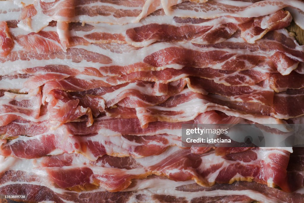 Dry cured pork belly, pork meat strips background