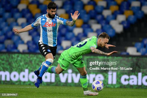 Manuel Lazzari of SS Lazio competes for the ball with Elseid Hysaj of SSC Napoli during the Serie A match between SSC Napoli and SS Lazio at Stadio...