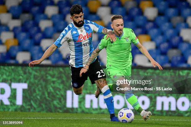 Manuel Lazzari of SS Lazio compete for the ball with Elseid Hysaj of SSC Napoli during the Serie A match between SSC Napoli and SS Lazio at Stadio...