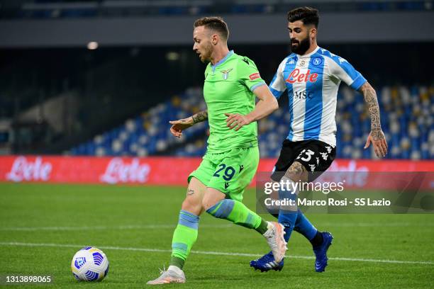 Manuel Lazzari of SS Lazio compete for the ball with Elseid Hysaj of SSC Napoli during the Serie A match between SSC Napoli and SS Lazio at Stadio...