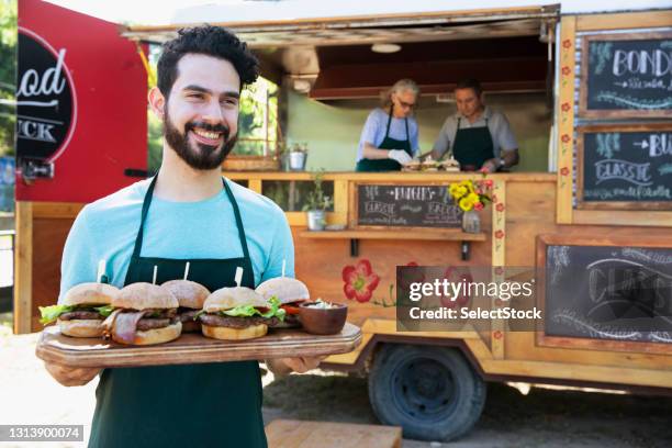 waiter serving food outside - waitress booth stock pictures, royalty-free photos & images