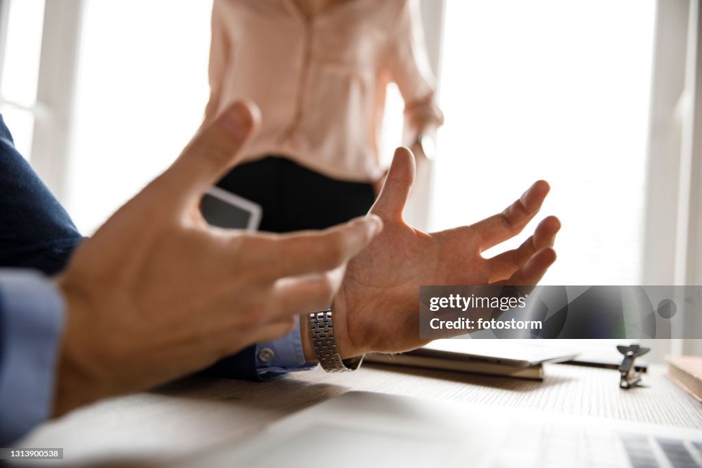 Businessman Explaining The Project Strategy To His Coworker High-Res ...