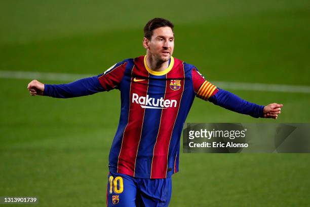 Lionel Messi of FC Barcelona celebrates after scoring their sides first goal during the La Liga Santander match between FC Barcelona and Getafe CF at...