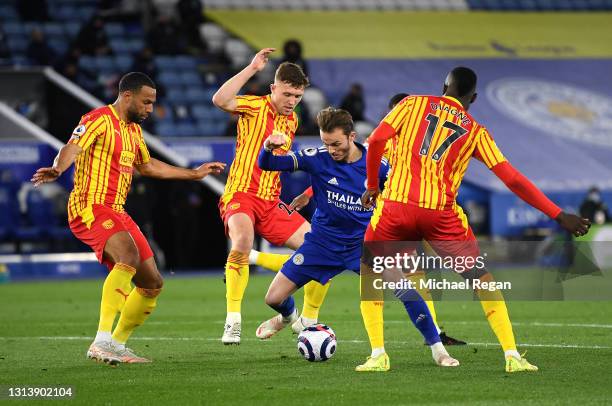 James Maddison of Leicester City battles for possession with Kyle Bartley, Dara O'Shea and Mbaye Diagne of West Bromwich Albion during the Premier...