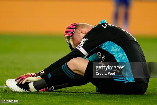Kasper Schmeichel of Leicester City reacts after being elbowed whilst gathering the ball during the Premier League match between Leicester City and...