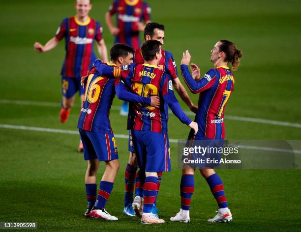 Pedri, Lionel Messi, Sergio Busquets and Antoine Griezmann of FC Barcelona celebrate their team's second goal, an own goal scored by Sofian Chakla of...