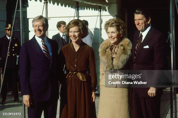 Outgoing US President Jimmy Carter and First Lady Rosalynn Carter receive President-Elect Ronald Reagan and Nancy Reagan at the White House,...