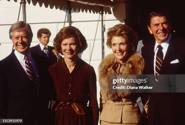 Outgoing US President Jimmy Carter and First Lady Rosalynn Carter receive President-Elect Ronald Reagan and Nancy Reagan at the White House,...