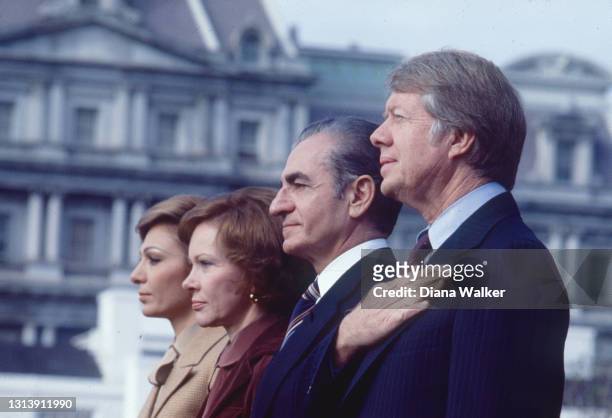 View of, in profile from left, Empress Farah Pahlavi of Iran, US First Lady Rosalynn Carter, the Shah of Iran Emperor Reza Palhevi, and US President...
