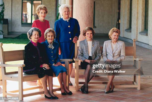 Portrait of former US First Ladies, seated from left, Lady Bird Johnson, Pat Nixon, Rosalynn Carter, and Betty Ford and, standing from left, Nancy...