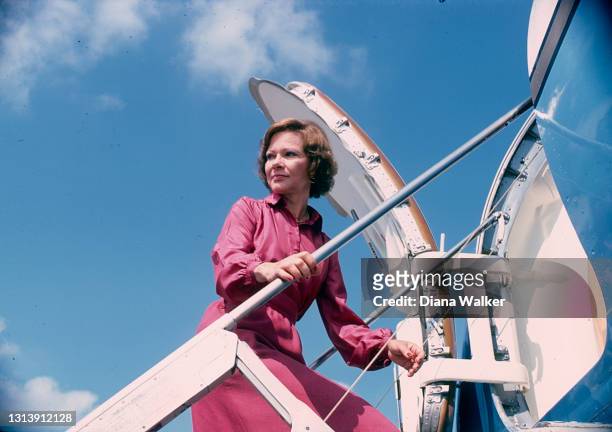 First Lady Rosalynn Carter climbs the steps to her plane during a trip, Texas, September 1978.