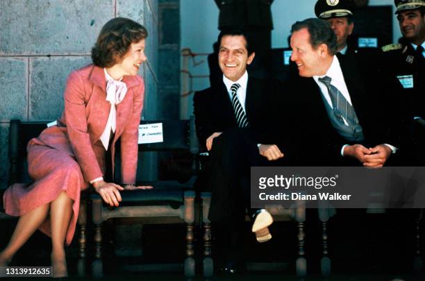 View of US First Lady Rosalynn Carter , Spanish Prime Minister Adolfo Suarez , and an unidentified man as they talk together before an inauguration...