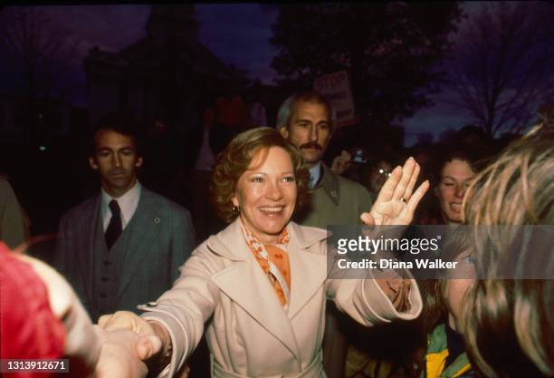 First Lady Rosalynn Carter shakes one hand and waves the other during an unspecified campaign event, New Hampshire, October 24, 1979.