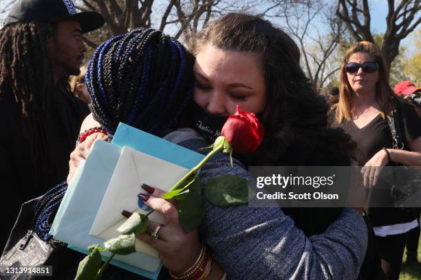 Katie Wright , the mother of Daunte Wright, is hugged following a brief ceremony at Lakewood Cemetery where the remains of her son were taken for...