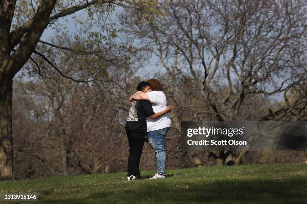 Family members of Daunte Wright embrace following a brief ceremony at Lakewood Cemetery where the remains of Wright were taken for cremation after a...