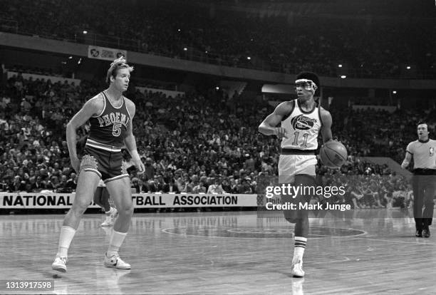 Phoenix Suns guard Dick Van Arsdale defends against Denver Nuggets guard Chuck Williams in the frontcourt during an NBA basketball game at McNichols...