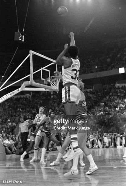 Denver Nuggets forward David Thompson shoots a jump shot over Phoenix Suns guard Dick Van Arsdale during an NBA basketball game at McNichols Arena on...