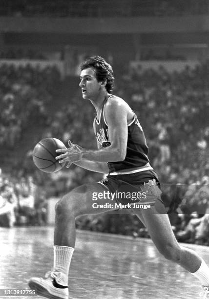 Phoenix Suns guard Paul Westphal dribbles the ball across the court during an NBA basketball game against the Denver Nuggets at McNichols Arena on...