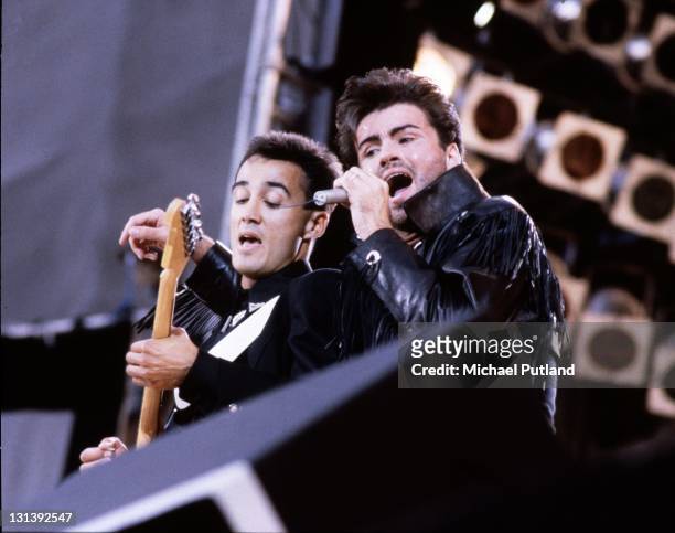 Andrew Ridgeley and George Michael of Wham! perform on stage at 'The Final Concert', Wembley Stadium, London, 28th June 1986.