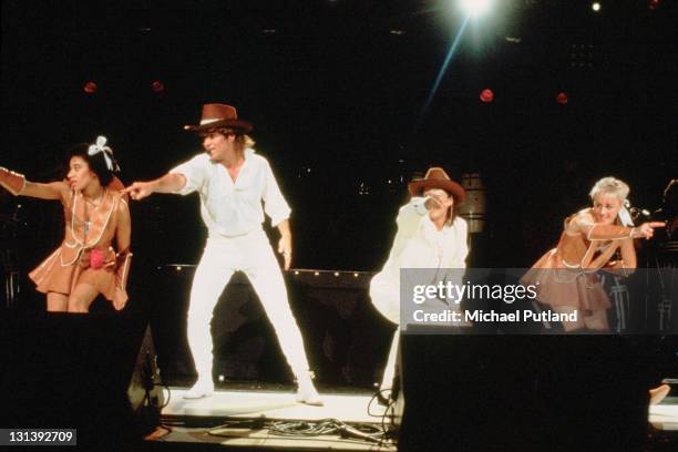 Wham! perform on stage with Pepsi and Shirlie at Sydney Entertainment Centre, Sydney, Australia, 27th January 1985, L-R L-R Helen 'Pepsi' DeMacque,...