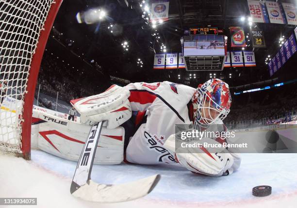 Ilya Samsonov of the Washington Capitals looks at the puck following a shoot-out goal by Anthony Beauvillier of the New York Islanders at the Nassau...