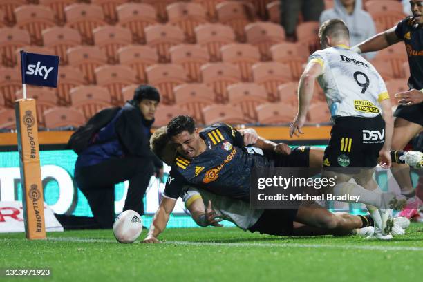 Anton Lienert-Brown of the Chiefs is unable to score a try to the round nine Super Rugby Aotearoa match between the Chiefs and the Hurricanes at FMG...