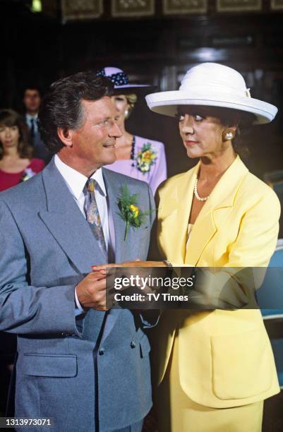 Coronation Street actors Amanda Barrie and Johnny Briggs in character as Alma Baldwin and Mike Baldwin during their wedding scene, circa 1992.