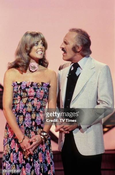Television host Bruce Forsyth and his assistant Anthea Redfern on the set of The Generation Game, circa 1978.