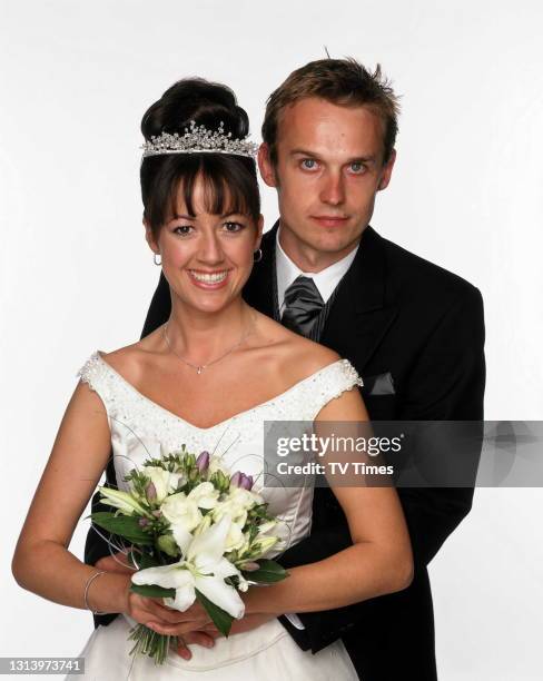 Emmerdale actors Sheree Murphy and Mark Charnock in character as Tricia and Marlon Dingle in their wedding outfits, circa 2002.