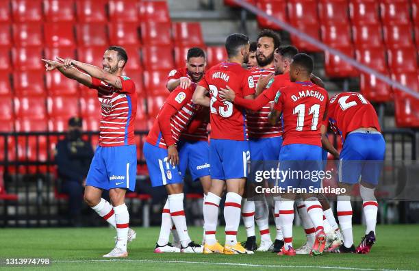 Roberto Soldado of Granada CF celebrates scoring a goal with team mates during the La Liga Santander match between Granada CF and SD Eibar at Estadio...