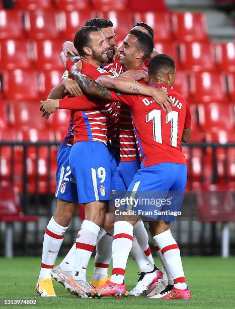 Roberto Soldado of Granada CF celebrates scoring a goal with team mates during the La Liga Santander match between Granada CF and SD Eibar at Estadio...