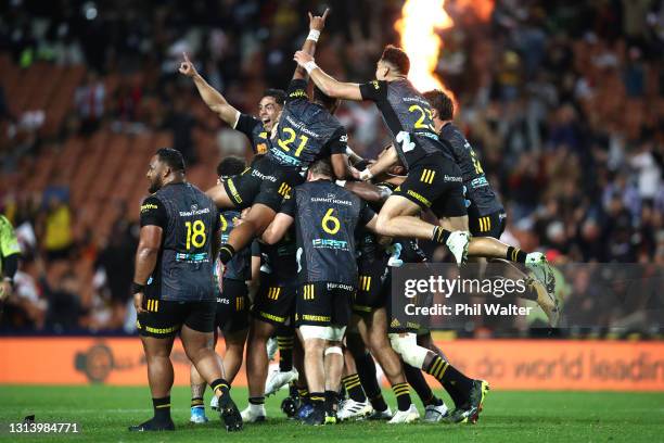 Damian McKenzie and the Chiefs celebrate his match winning penalty kick during the round nine Super Rugby Aotearoa match between the Chiefs and the...