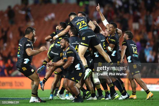 Damian McKenzie and the Chiefs celebrate his match winning penalty kick during the round nine Super Rugby Aotearoa match between the Chiefs and the...